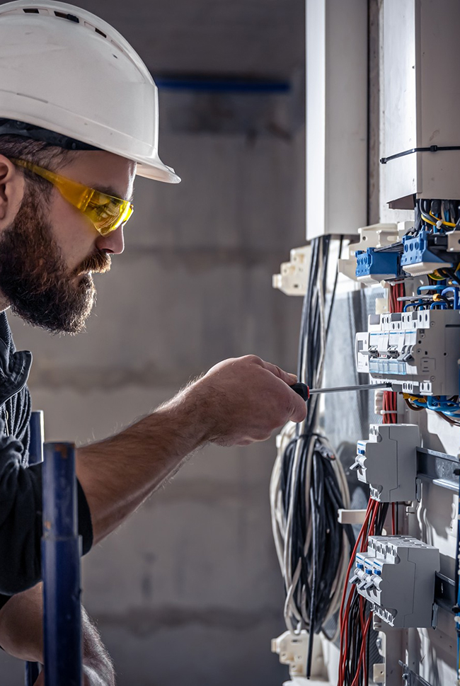 electrician working on panel